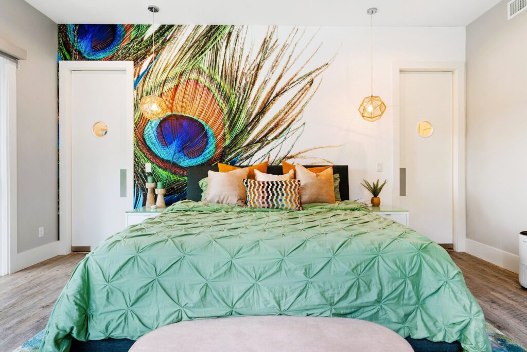 Peacock decorated master bedroom close up in airbnb vacation home short term rental designed by Magic Interiors