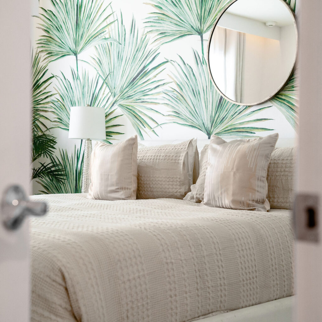 tropical guest bedroom close up in airbnb vacation home short term rental designed by Magic Interiors