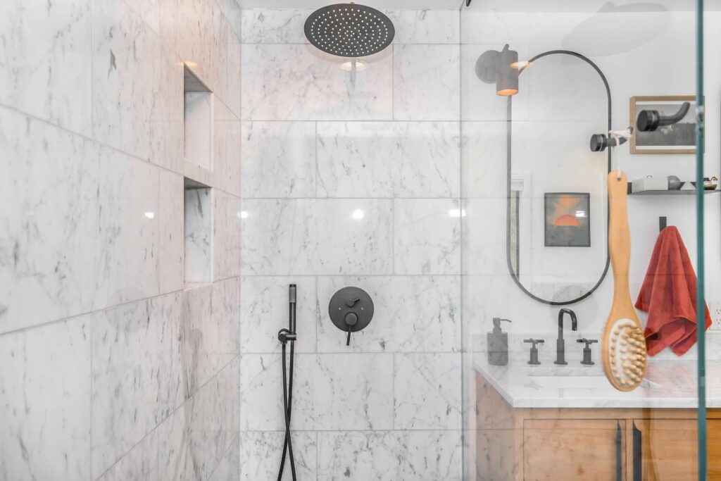 Luxurious bathroom with marble countertops and glass shower enclosure